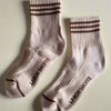 Pair of beige socks with brown accents and 'Le Bon Shoppe' branding on a light gray background.